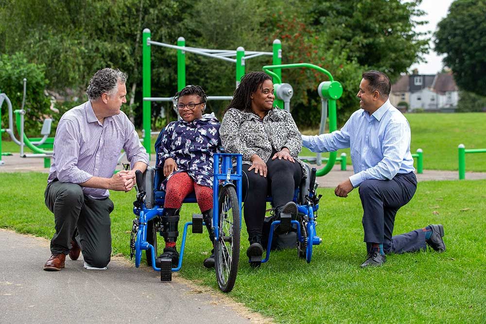 Cllr Ian Barnes and Cllr Mahtab Uddin meet young people at the summer holiday cycling club for children and young people with Special Educational Needs and Disabilities
