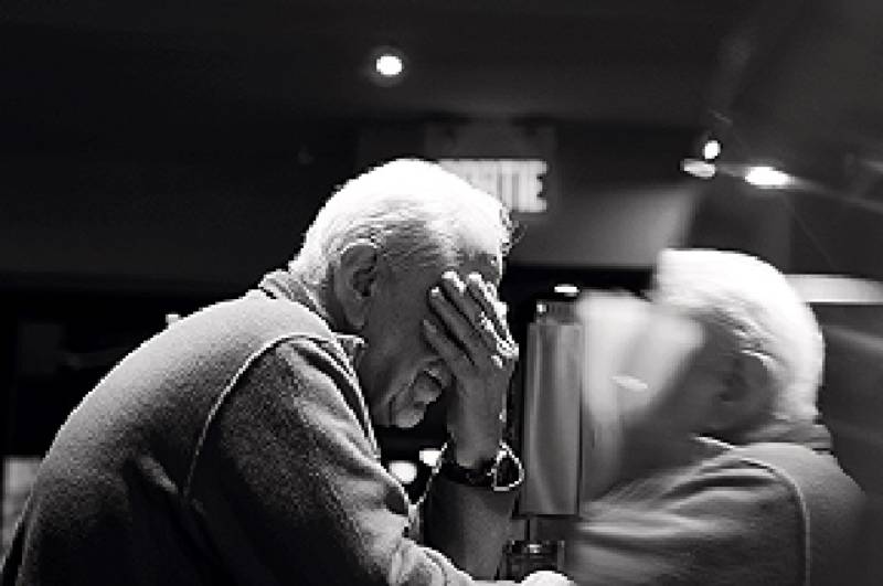 Older person seated at a table