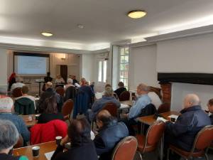 Group of people sitting at a meeting