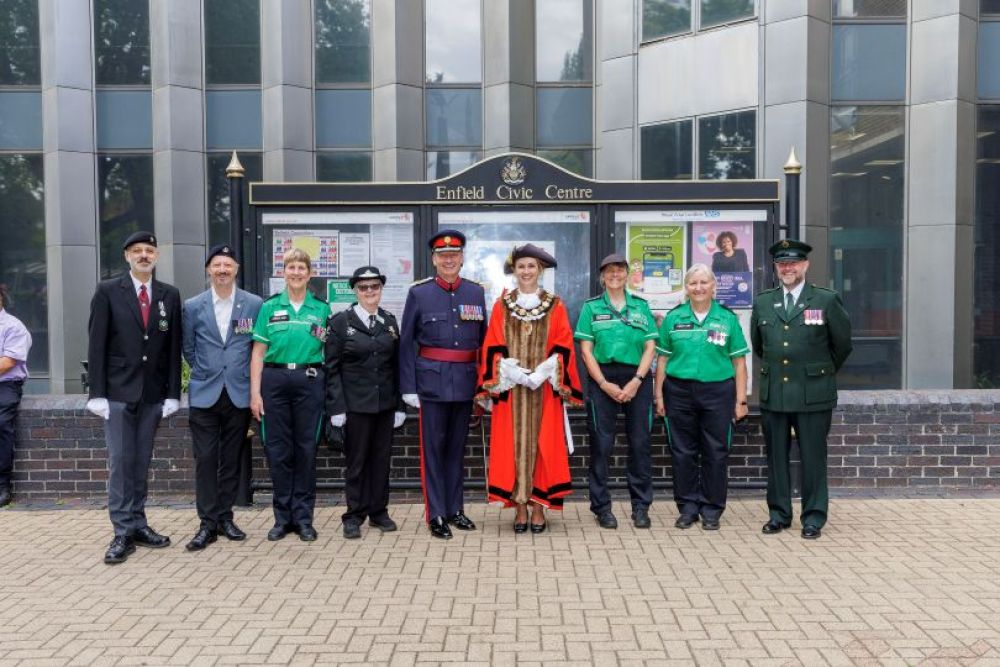 Mayor with service people outside civic centre