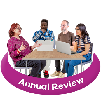 People sitting round a table with laptops