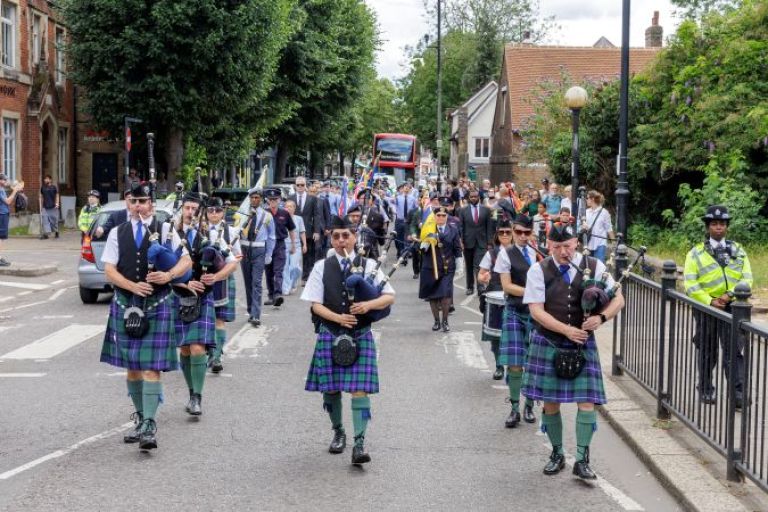 Pipers in the Armed Forces Day Parade through Enfield