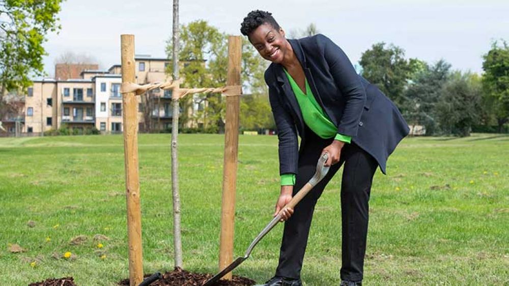 Cllr Chinelo Anyanwu planting a tree in Enfield Town Park