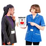 2 professionals with one holding a referral document