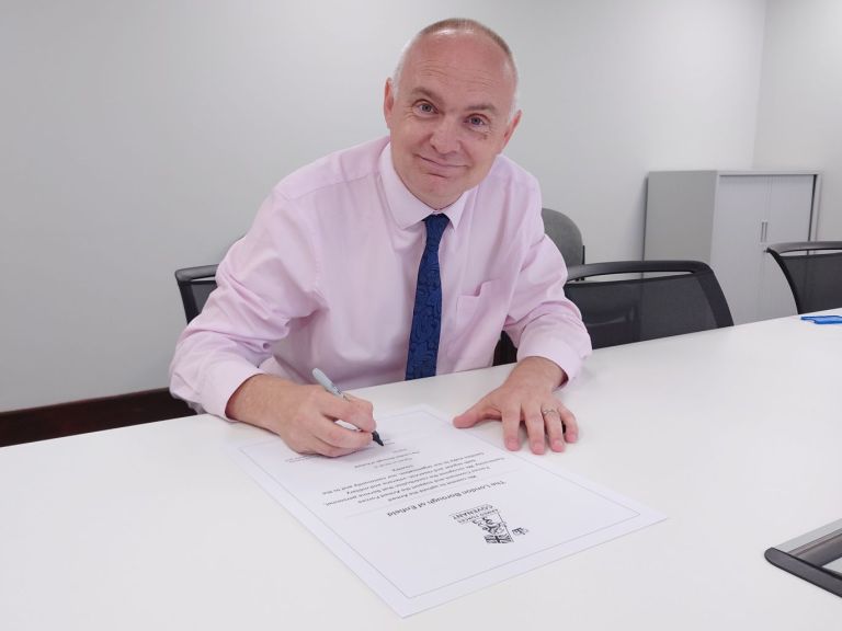 Cllr Thorp signing the Armed Forces Covenant