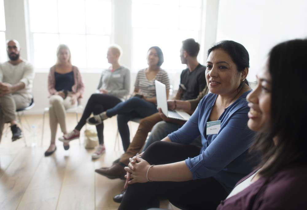 Professionals seated in a clinical setting