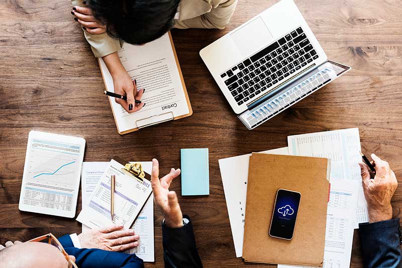 Laptop and notepads on a desk