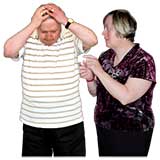 Man holding his head next to a woman