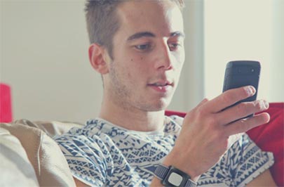 Young man looking at his mobile phone