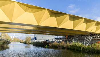 Close up of yellow bridge over a river
