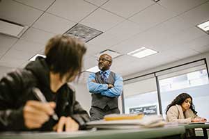 Teacher with 2 students in a classroom