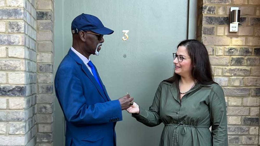 Cllr Nesil Caliskan hands over the keys to a home to one of the first Council residents at Meridian Water