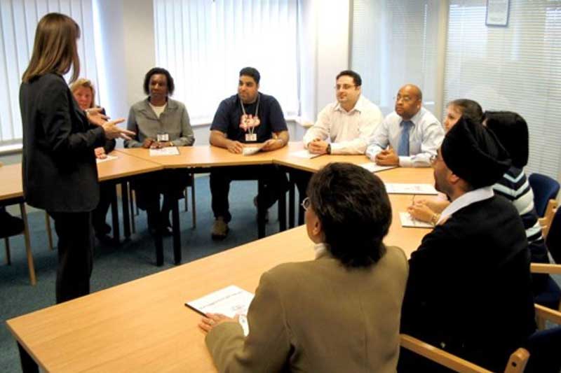 Group of people sitting round a table