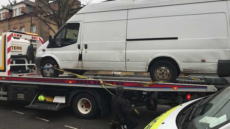 A vehicle being seized for fly-tipping offences