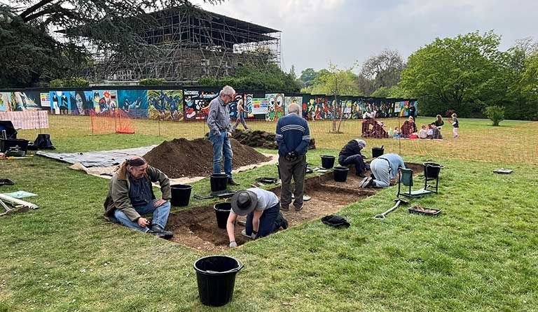 Volunteers from the Enfield Archaeological Society with Hazlewood School students at the excavation site